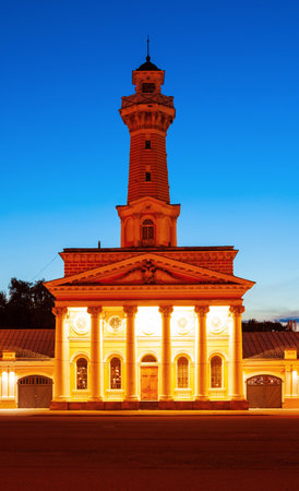 Fire observation watchtower or watch tower at the Susaninskaya main square in Kostroma city, Golden Ring of Russia at sunsetの写真素材