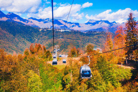Cable car cabin rises up from Rosa Khutor village to Roza Peak mountain in Sochi resort city in Krasnodar Krai, Russiaの写真素材