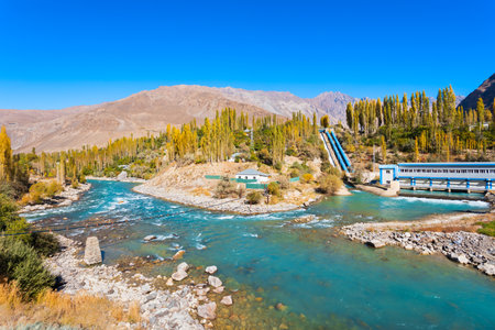 Dam on the Ghunt river and Pamir mountains aerial panoramic view. Khorog is situated along the Pamir Highway in Gorno-Badakhshan, Tajikistan.の写真素材