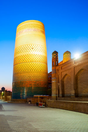 Kalta Minor Minaret at the Itchan Kala, the walled inner town of the city of Khiva in Uzbekistan at nightの写真素材