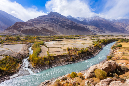 Floodplains in the Wakhan Corridor in the Badakhshan province of Afghanistan, view from the Qah Qaha or Kaakha fortress in Namadgut, Tajikistan.の写真素材