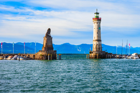 New Lindau Lighthouse and Bavarian Lion Sculpture at the Lindau harbor. Lindau is a major town and island on the Lake Constance or Bodensee in Bavaria, Germany.の写真素材