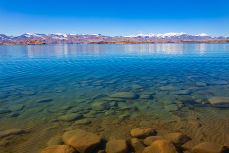 Beauty Karakul lake. Karakul or Qarokul lake is located in the Pamir Mountains near the border with China and Kyrgyzstan in Murghab region in Tajikistan.の写真素材