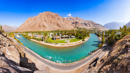 Khorog city, Ghunt river and Pamir mountains aerial panoramic view. Khorog is situated along the Pamir Highway in Gorno-Badakhshan, Tajikistan.の写真素材