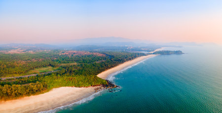 Galgibaga, Talpona and Rajbag beach aerial panoramic view at sunset. Galgibaga or Galgibagh beach is a public beach located near the Palolem beach in South Goa in India.の写真素材