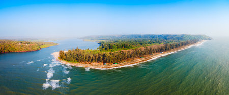 Querim beach and Terekhol river aerial panoramic view. Arambol Beach is a public beach located in North Goa in India.の写真素材