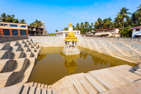 Murdeshwara Pushkarani temple pond and Olaga Mantapa Temple in Murdeshwar town. Murdeshwar is the coastal town in Karnataka state of India.の写真素材