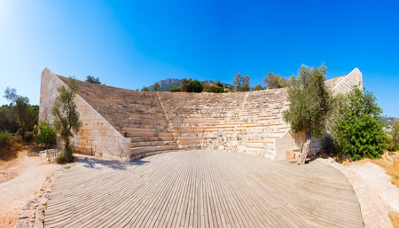 The ancient Greek theatre at the Antiphellus or Antiphellos Ancient City in modern Kas or Kash town in Antalya Province in Turkeyの写真素材