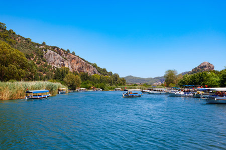 Boats at Dalyan river in Dalyan town in Mugla Province, Turkeyの写真素材