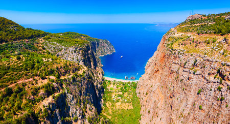 Butterfly Valley Beach or Kelebekler Vadisi aerial panoramic view. Butterfly Beach is a beautiful beach near Oludeniz town, district of Fethiye in Turkey.の写真素材