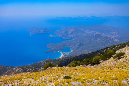 Oludeniz and Blue Lagoon beach aerial panoramic view from Babadag mountain viewpoint in Turkey in Fethiye district of Mugla Province, Turkey.の写真素材