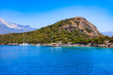 Boat at the Gemiler or St. Nicholas Island near Oludeniz village, district of Fethiye in Turkeyの写真素材
