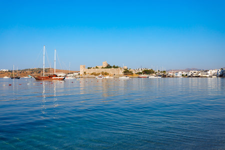 The Bodrum Castle of St. Peter and marina with boats in Bodrum city. Bodrum is a city in Mugla Province, Turkey.の写真素材