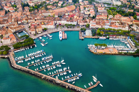 Desenzano del Garda harbor aerial panoramic view. Desenzano is a town on the shore of Lake Garda in the Brescia province in Lombardy, Italy.の写真素材