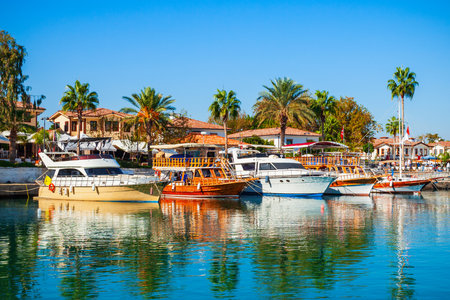 Boats at the pier in Side town, situated in Antalya region on the southern Mediterranean coast of Turkey.の写真素材