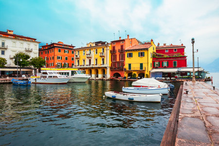 Harbor with boats in the Malcesine old town on the shore of Lake Garda in Verona province, Italyの写真素材