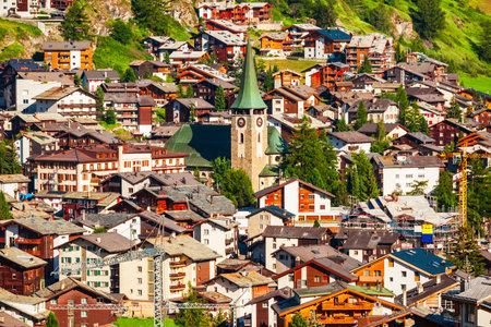 Traditional local houses in the centre of Zermatt town in the Valais canton of Switzerlandの写真素材