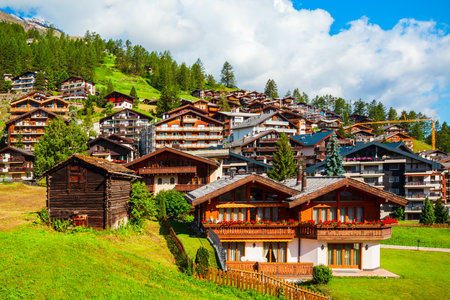 Traditional local houses in the centre of Zermatt town in the Valais canton of Switzerlandの写真素材