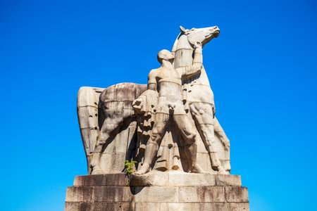 Man and horse monument statue in Nordpark, public green area in the Stockum district in Dusseldorf city in Germanyの写真素材