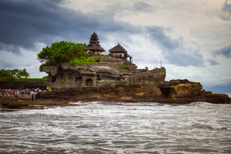 Pura Tanah Lot Temple and rock formation in Bali island in Indonesiaの写真素材