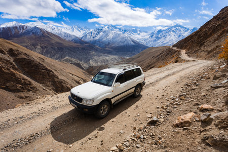 Off-road vehicle at the Pamir highway in Wakhan Corridor after Langar village. Wakhan Corridor is located on the border between Tajikistan and Afghanistan.の写真素材