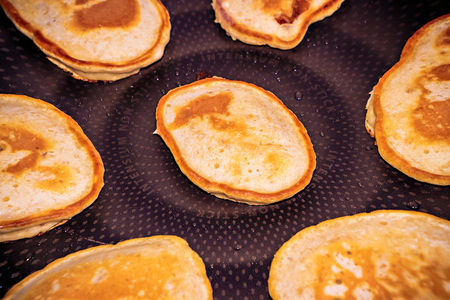 cooking pancakes in a frying pan closeup