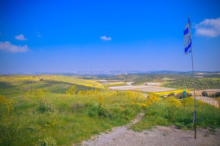 flat landscape in Israel with flag onの写真素材