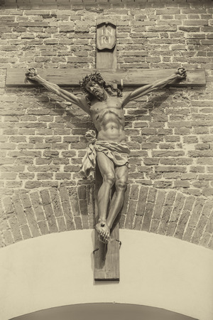 jesus christ on the cross at the entrance to the brick wall of Lvivの写真素材