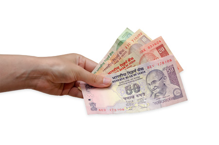 Rupees in hand woman, isolated on white background