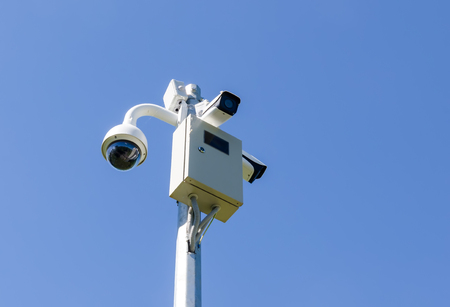CCTV camera on sky backgroundの写真素材