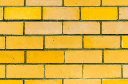 the texture of the walls of yellow brickの写真素材