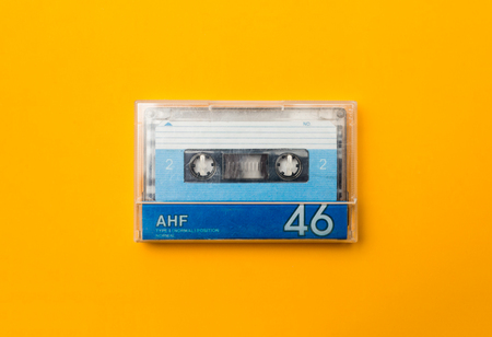audio cassete in case, on yellow