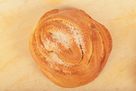 country sugar bun toned on wood background