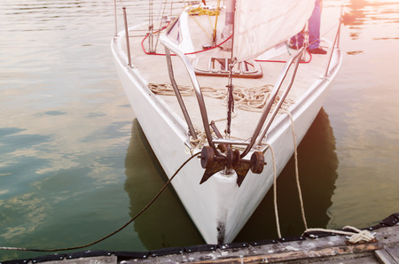 moored white yacht, evening