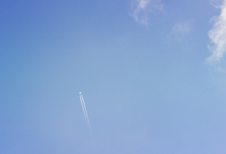 The plane is far in the sky