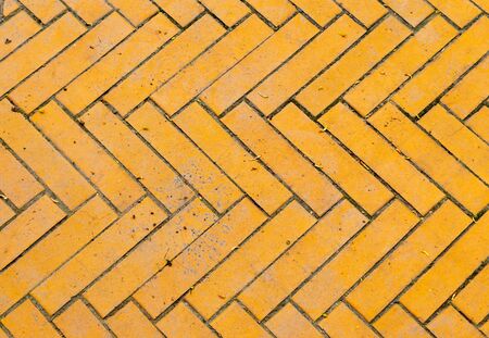 Fragment of an old yellow brick roadの写真素材