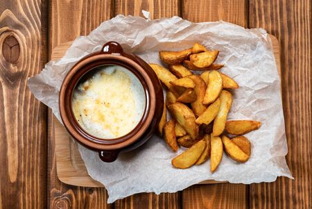 Potato wedges on wooden backgroundの写真素材