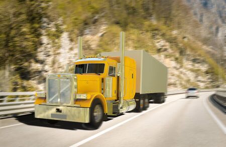 Freight yellow truck on roadの写真素材