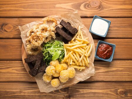 Fast food. French fries, cheese balls, onion rings.