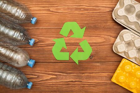 Eco concept with recycling plastic. paper and glass on table background top viewの写真素材