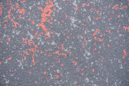 Texture of old asphalt with red dropsの写真素材