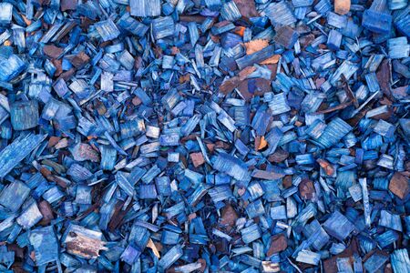 Texture of blue brightly painted wood shavings