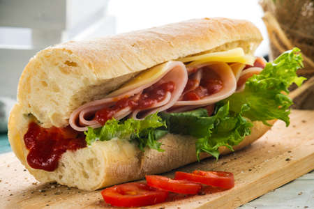 Ham and Cheese Sandwich with Red Sauceの写真素材