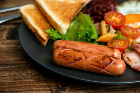 Rustical breakfast eggs, sausages, vegetables. Selective focusの写真素材