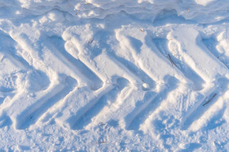 Texture from the tractor tire on the snow