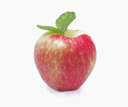 Red apple with leaf on white background
