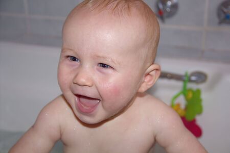Happy baby bathing