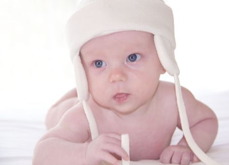 Sweet tiny baby in the hat on white backgroundの写真素材
