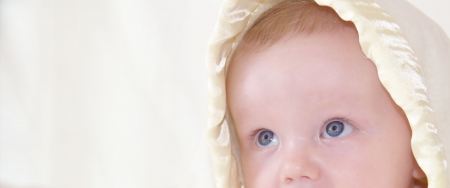 Cute baby is looking up with space の写真素材