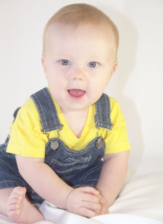 Adorable baby boy is sittingの写真素材